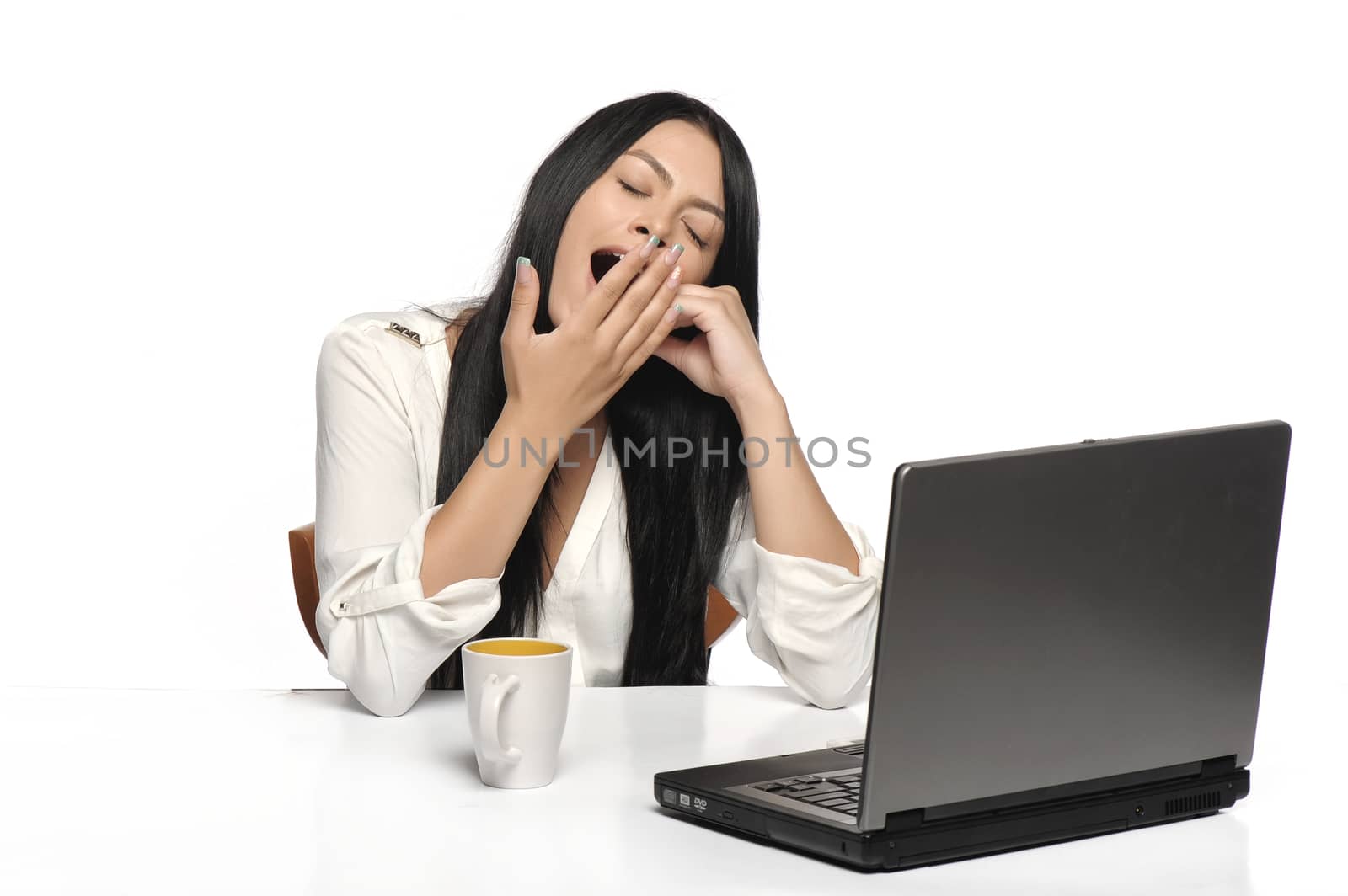Bored business woman working on laptop looking very boring at the computer, Isolated white background