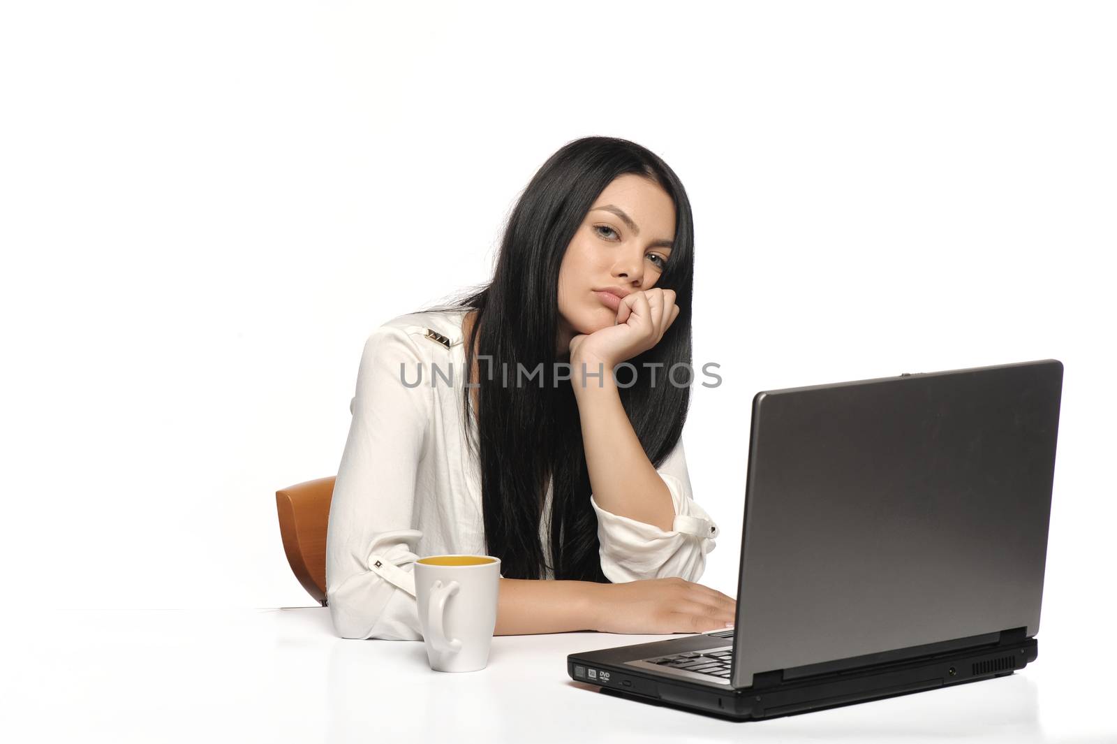 Bored business woman working on laptop looking very boring at the computer, Isolated white background