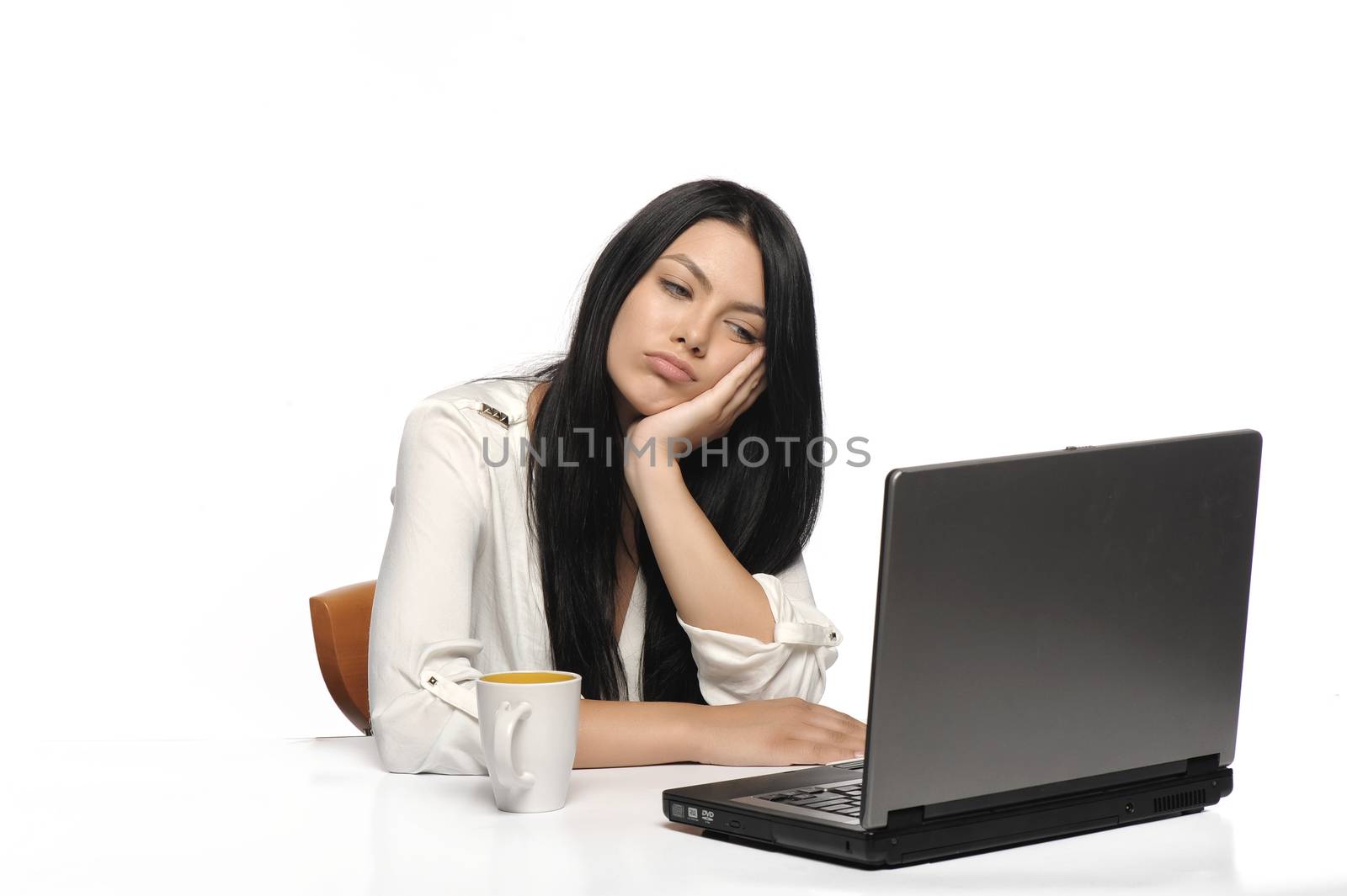 Bored business woman working on laptop looking very boring at the computer, Isolated white background by catalineremia