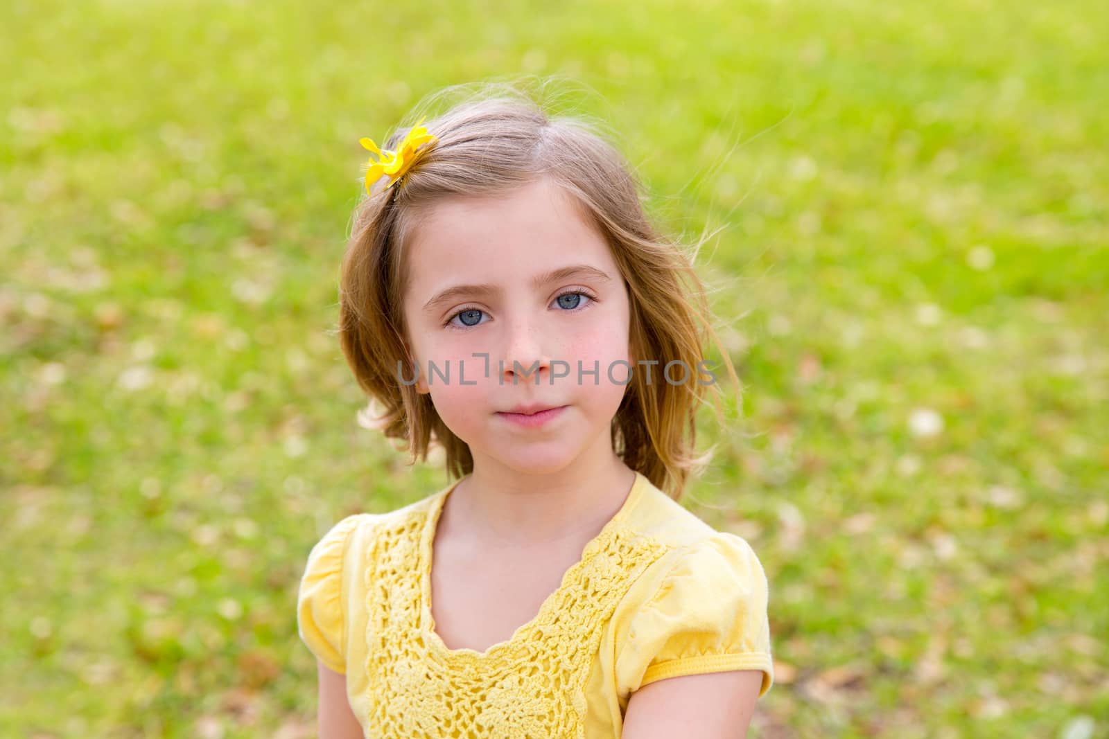 little blond girl portrait in park by lunamarina