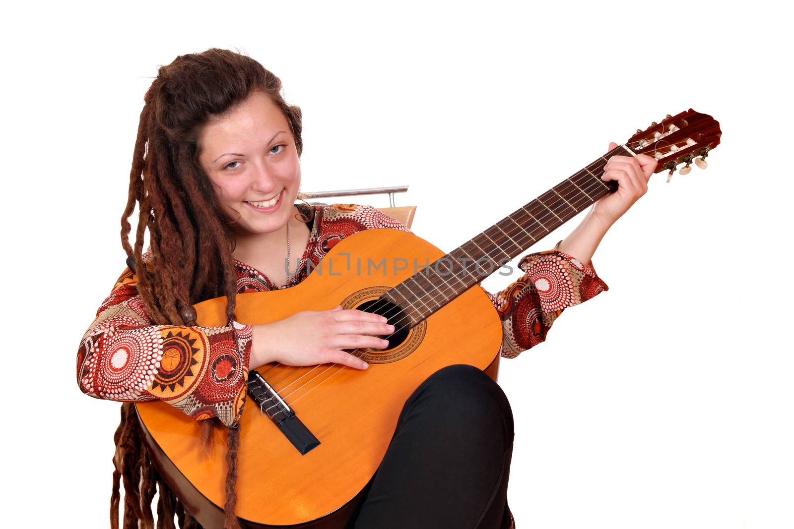 happy girl with dreadlocks play acoustic guitar by goce