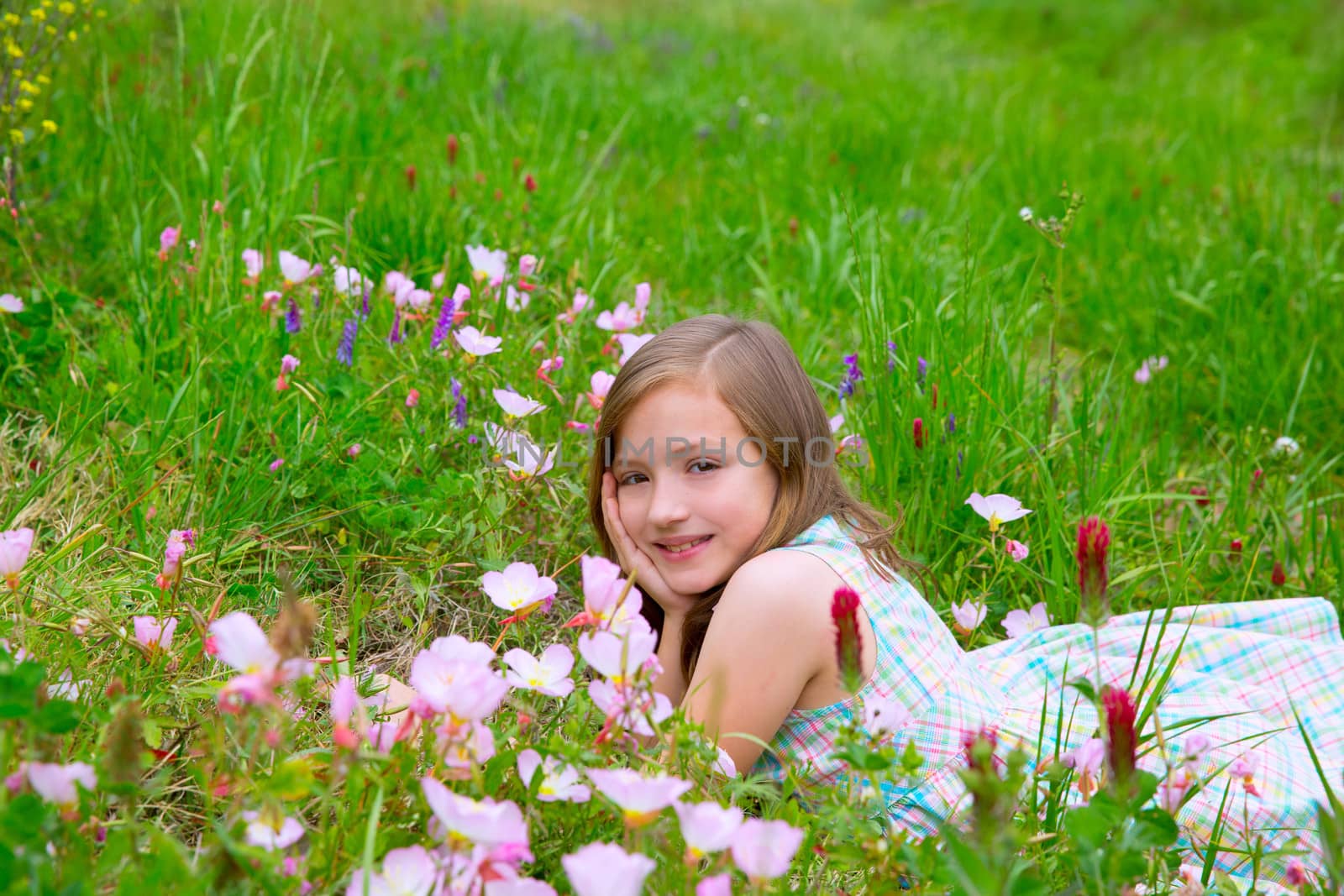 children cute girl on spring meadow with poppy flowers by lunamarina