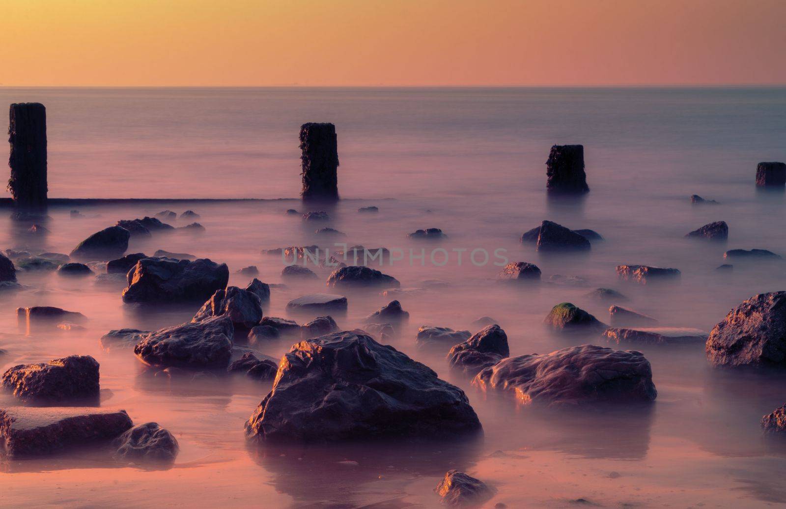 Pebbles,rocks and groynes on the beach.
Taken at Leysdown in Kent