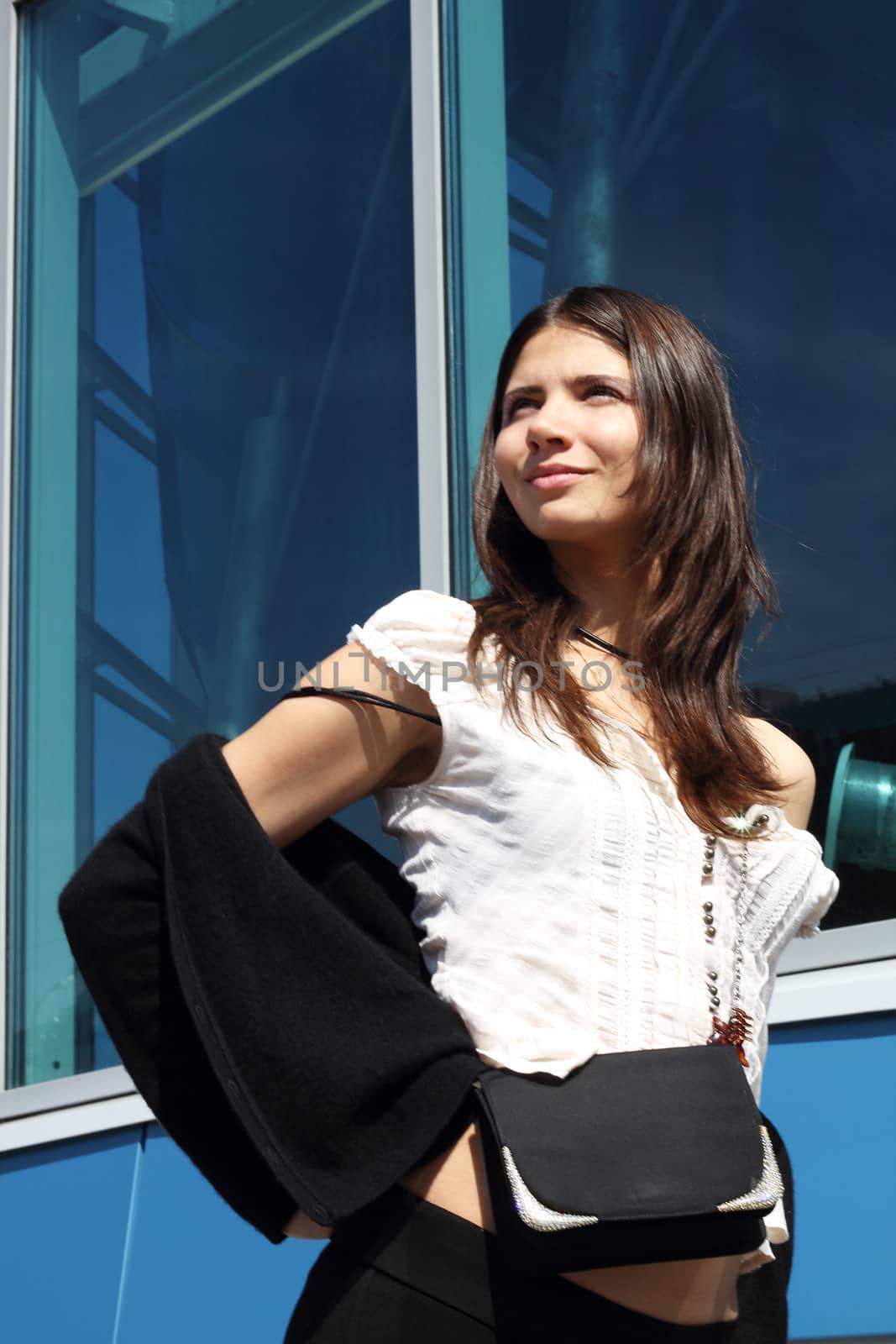 Young woman portrait on modern building background