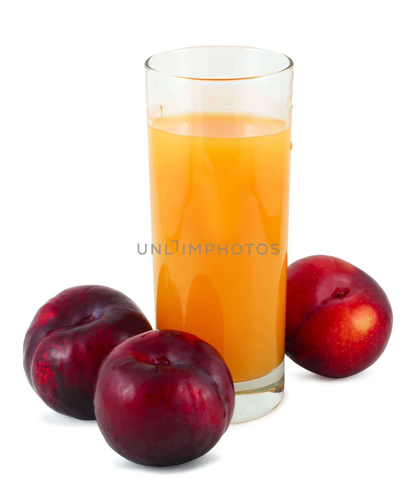 Glass of plum juice and three plums isolated on white background