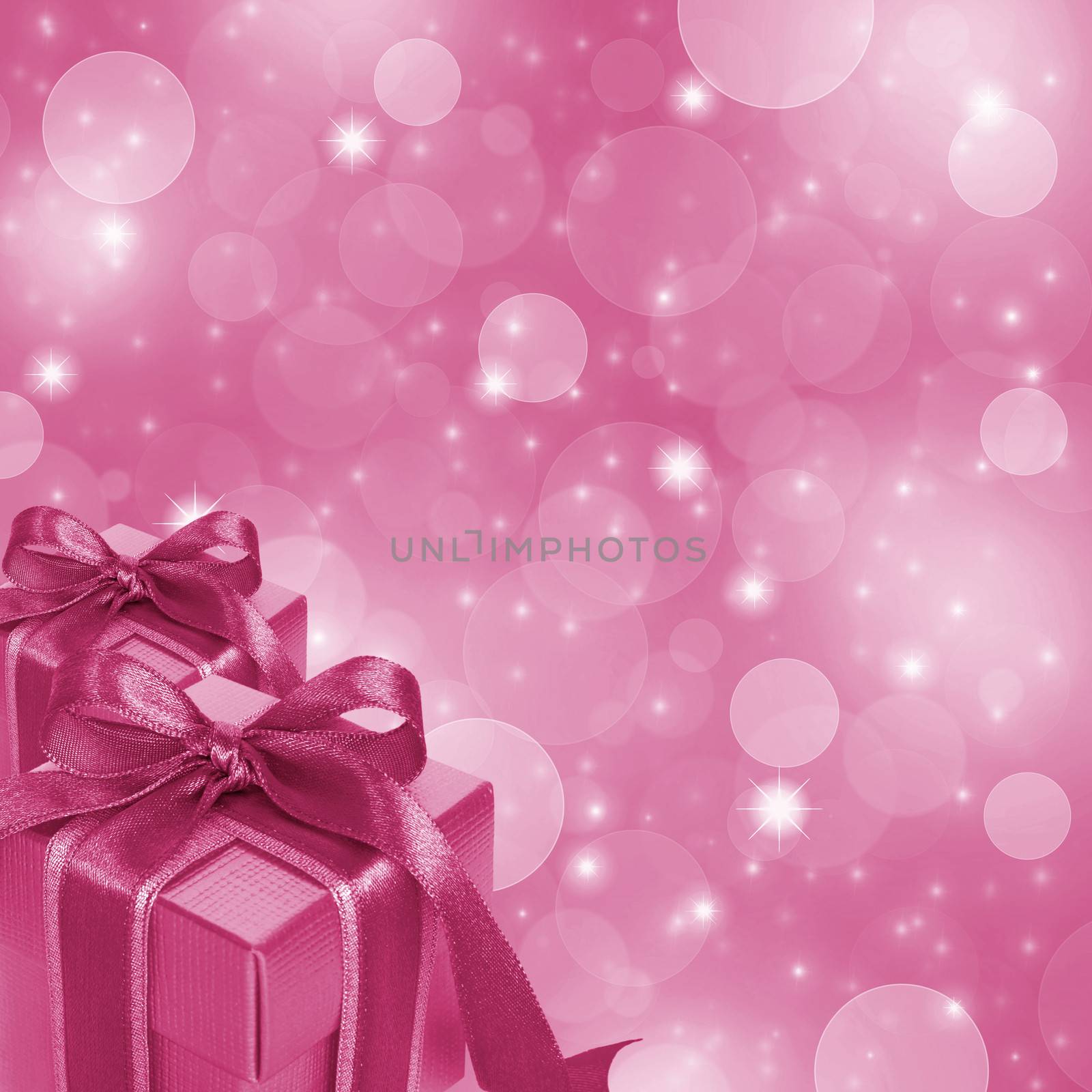 Pink gift boxes on abstract pink glitter background