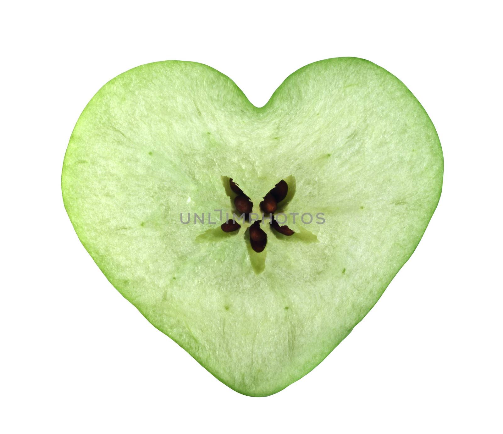 Green apple cross section shaped like heart on white background