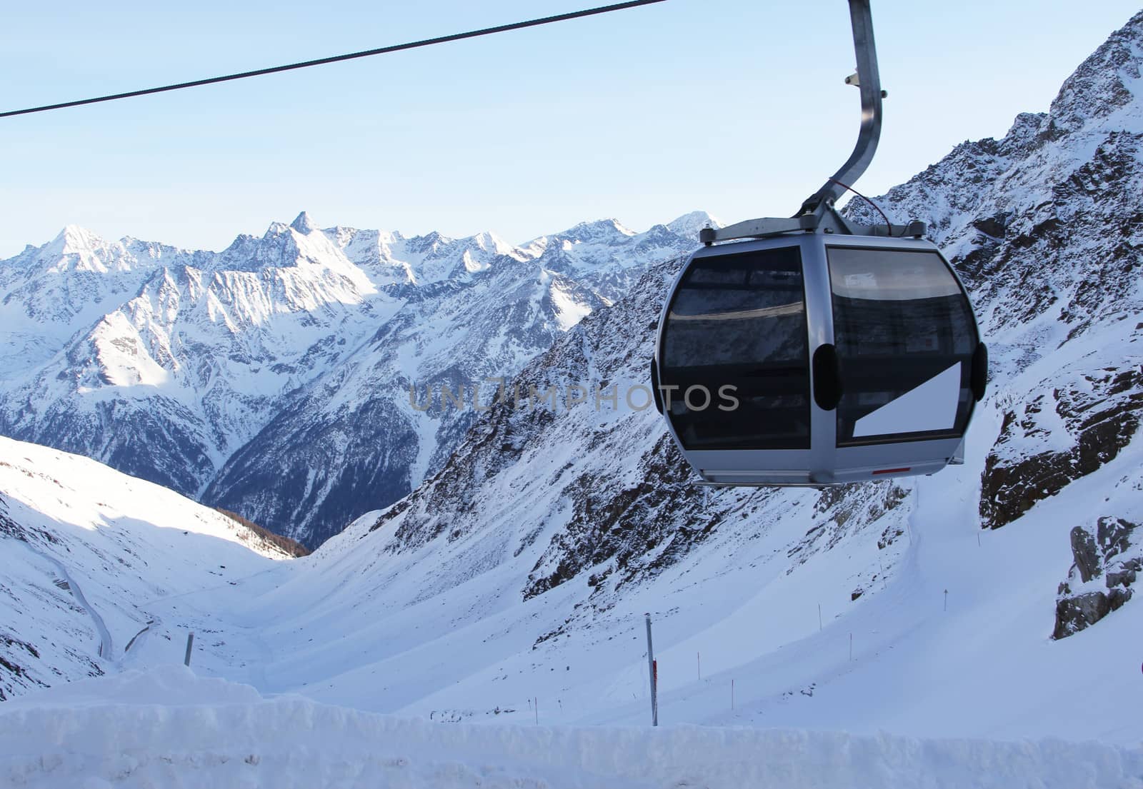 chairlift in beautiful winter snowy alpine mountains