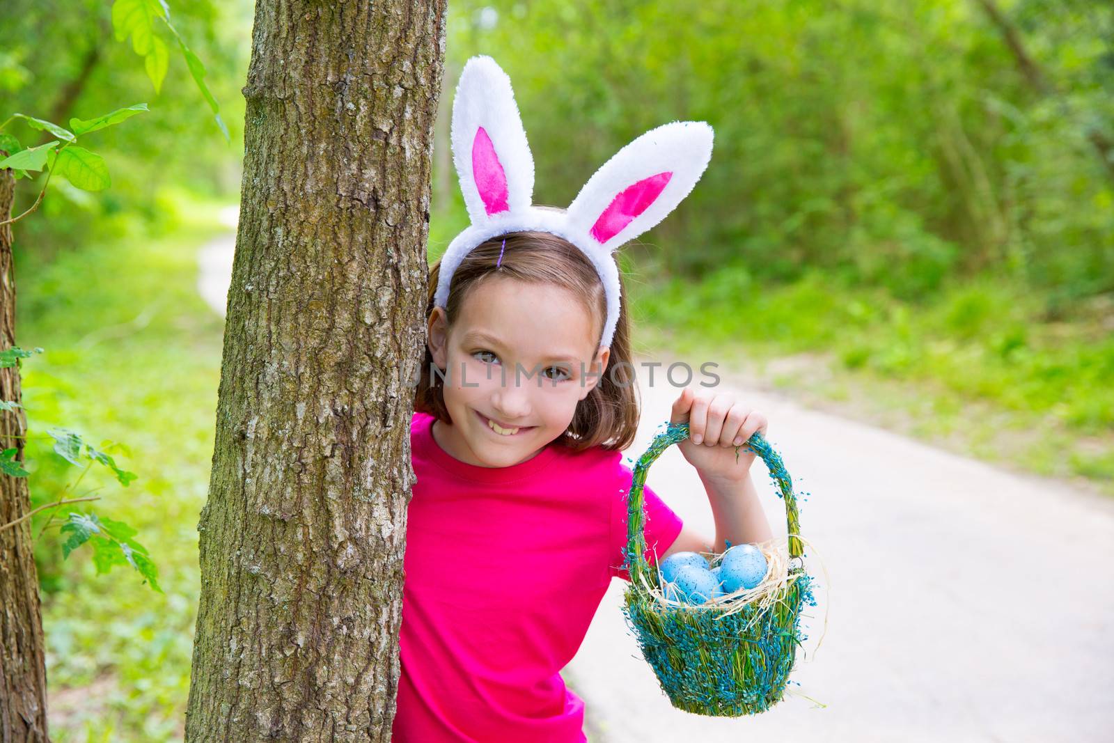 Easter girl with eggs basket and funny bunny face by lunamarina