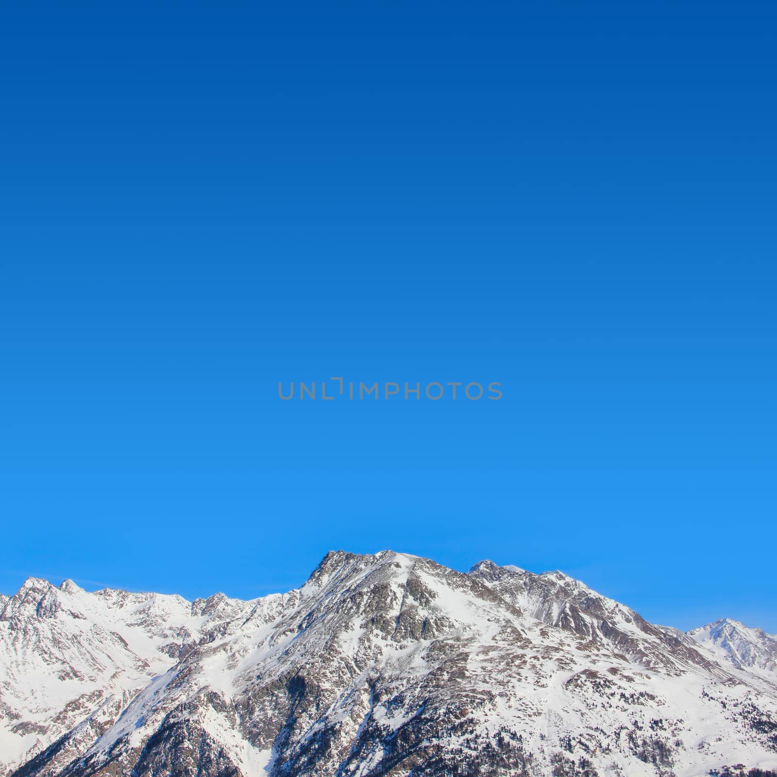 Hight mountains under blue sky beautiful winter panorama