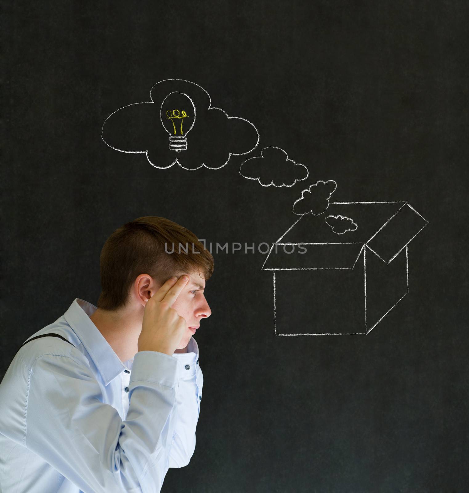 Businessman, student or teacher thinking out the box chalk concept blackboard background