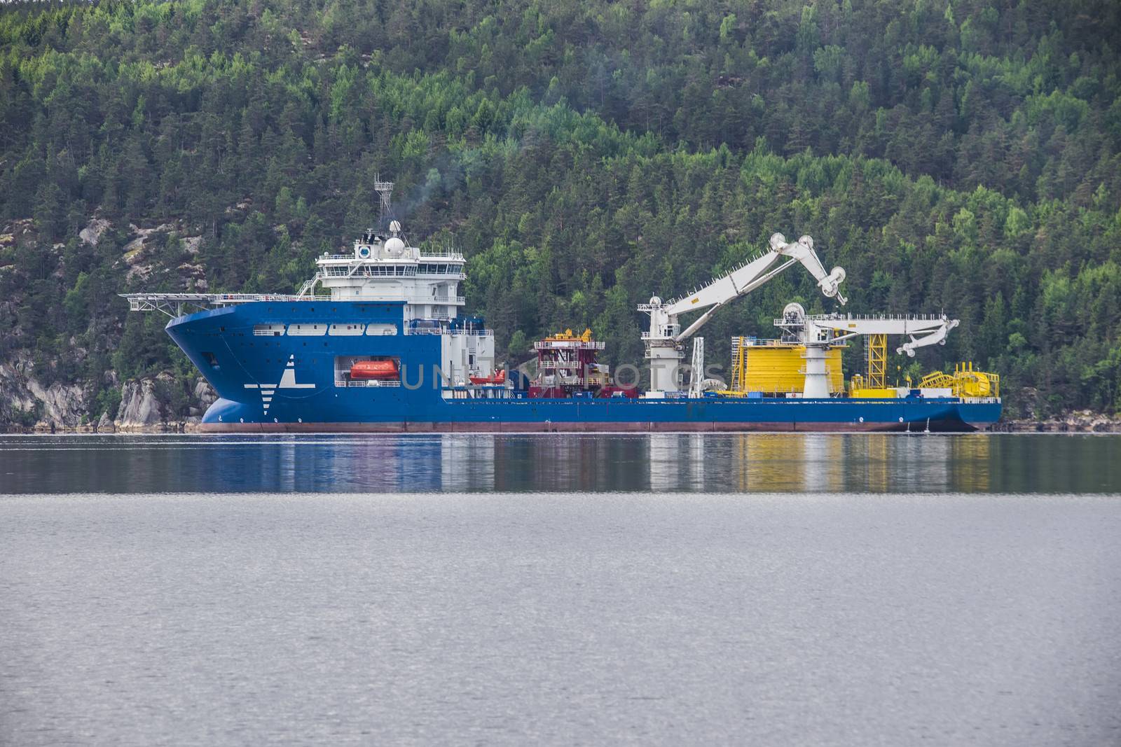 North sea giant is a large offshore supply ship. The picture is shot from the port of Halden, Norway and out towards Iddefjord where the ship is at anchor.