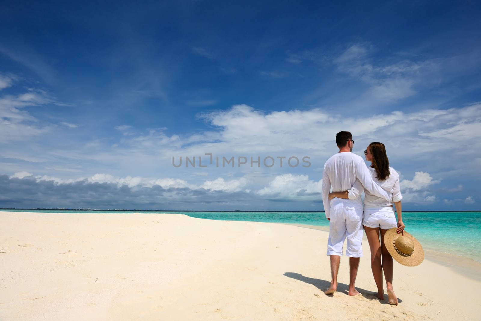 Couple on a tropical beach at Maldives