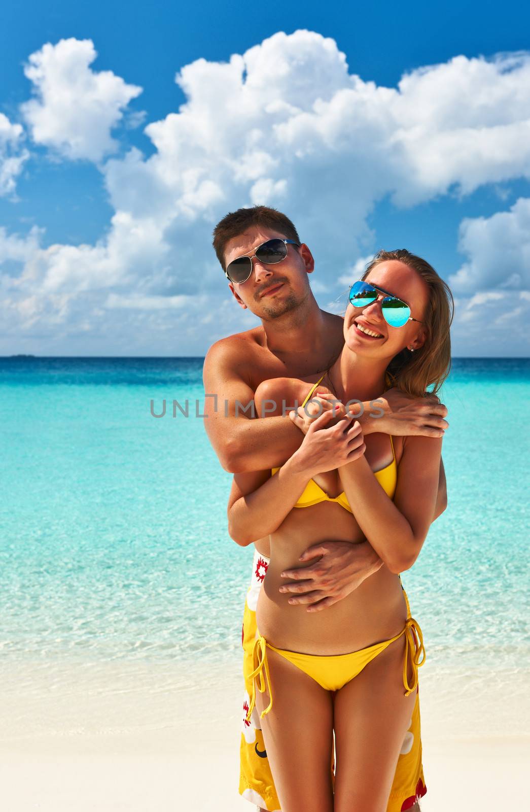 Couple on a tropical beach at Maldives