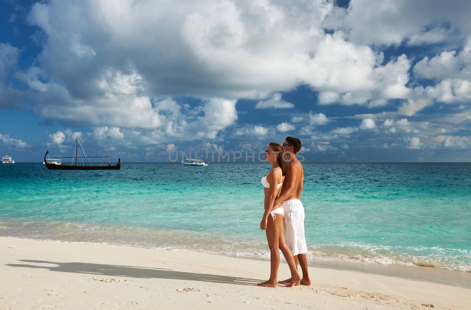 Couple on a tropical beach at Maldives