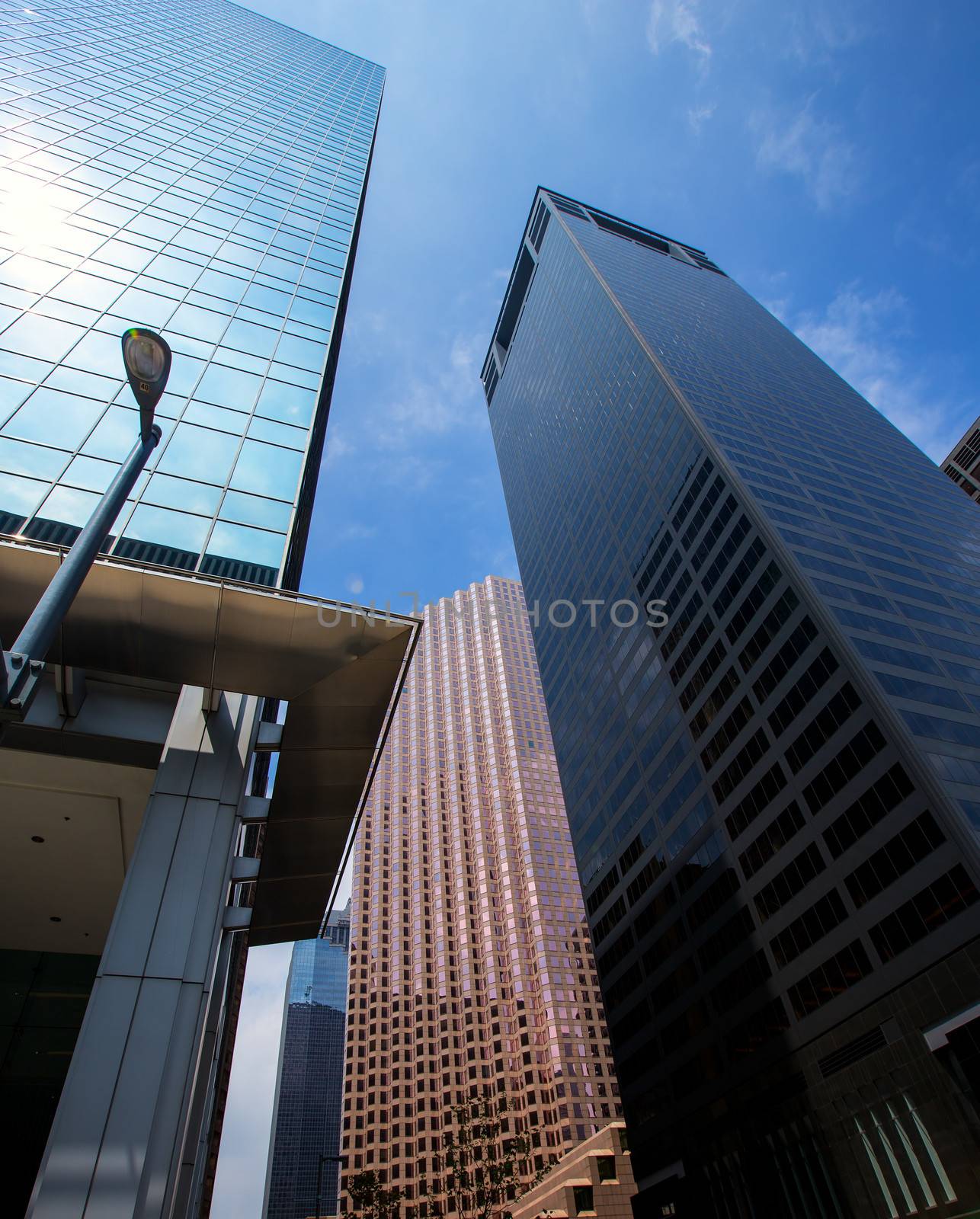 Houston downtown skyscrapers disctict with mirror blue sky reflection