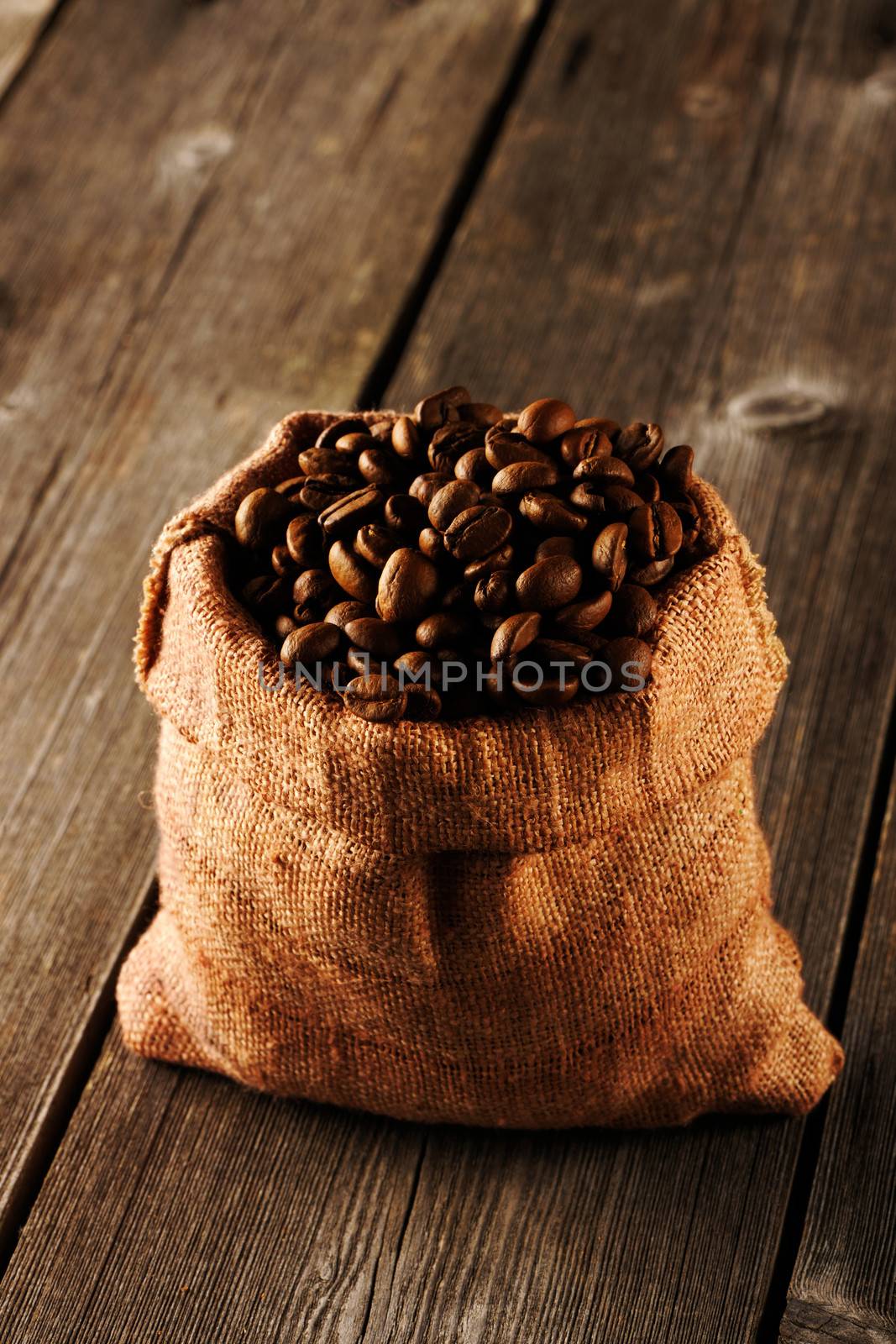 Coffee beans in bag on table by haveseen