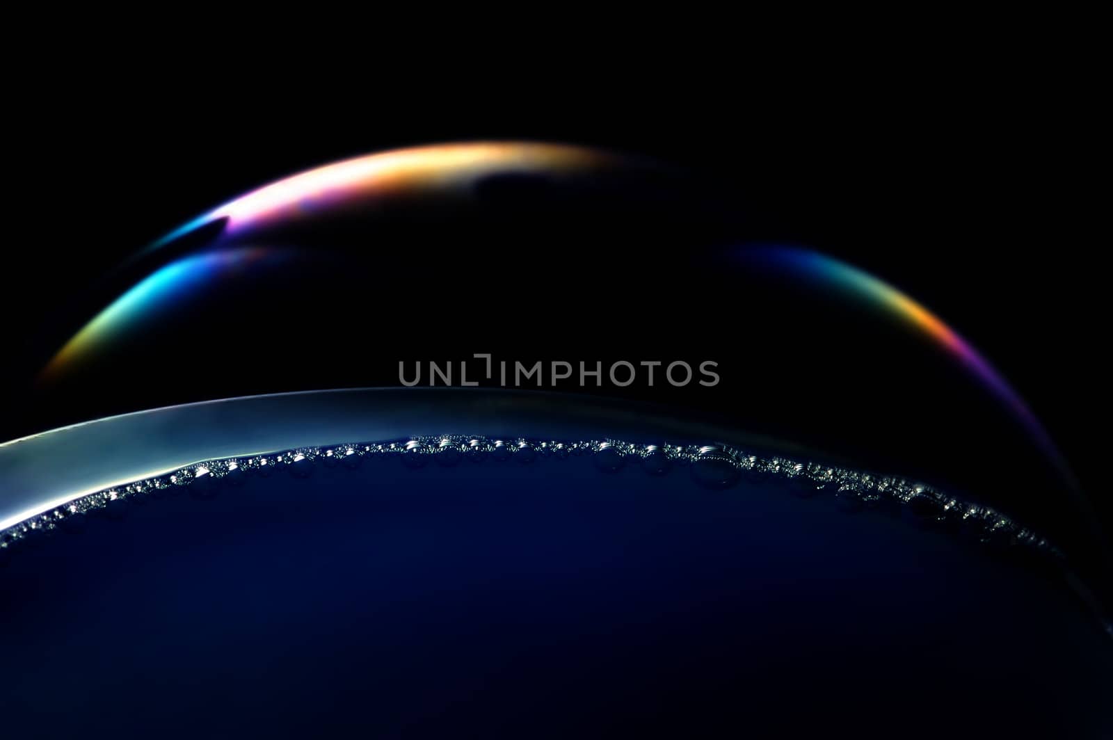 Abstract macro of bubble with glistening water drops