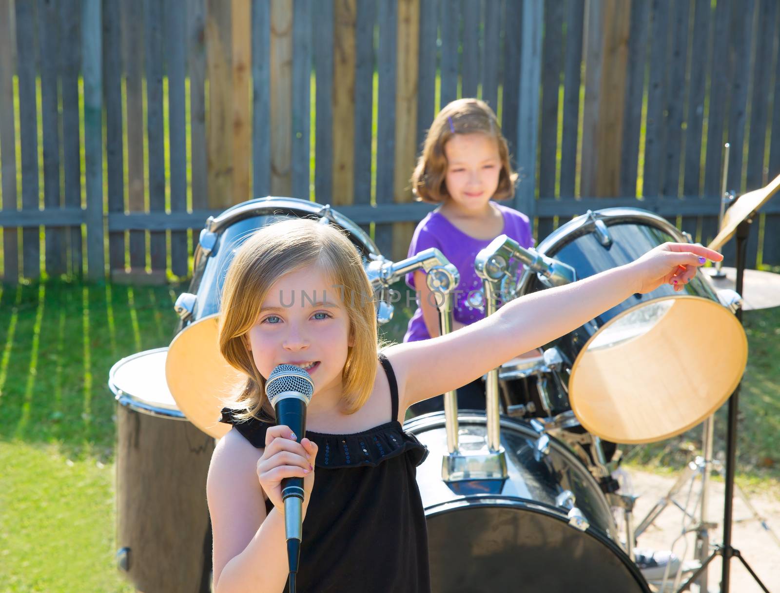 chidren singer girl singing playing live band in backyard by lunamarina