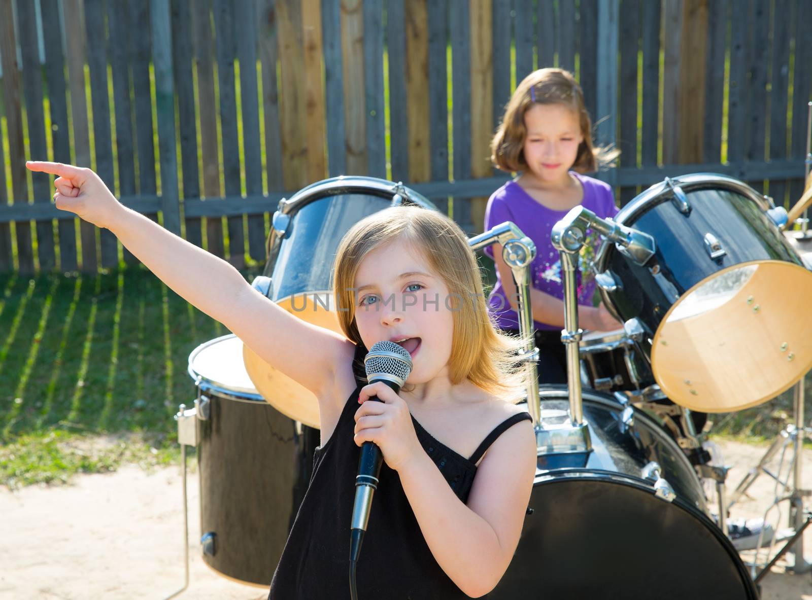 chidren singer girl singing playing live band in backyard by lunamarina