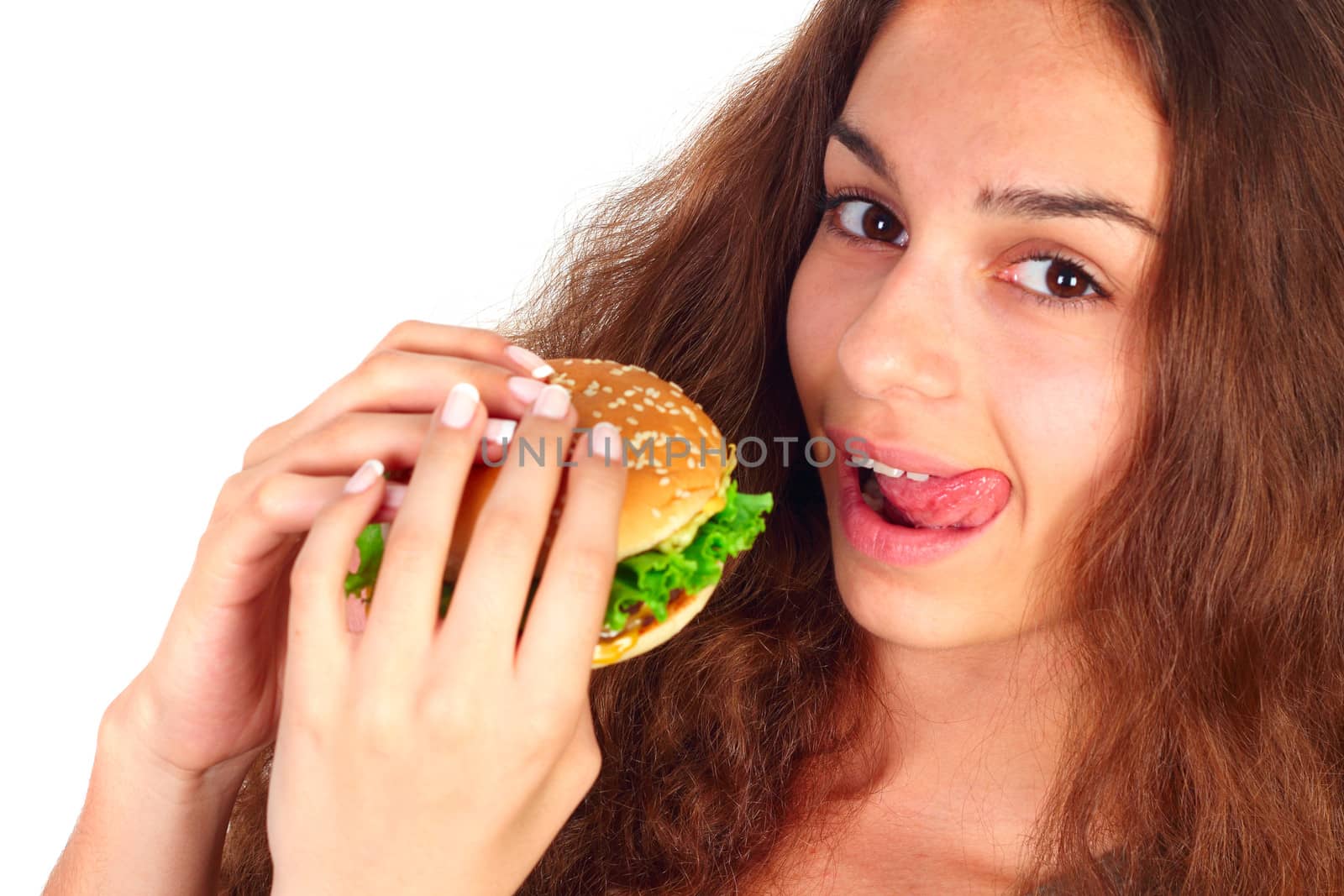 Young woman eating hamburger isolated on white background