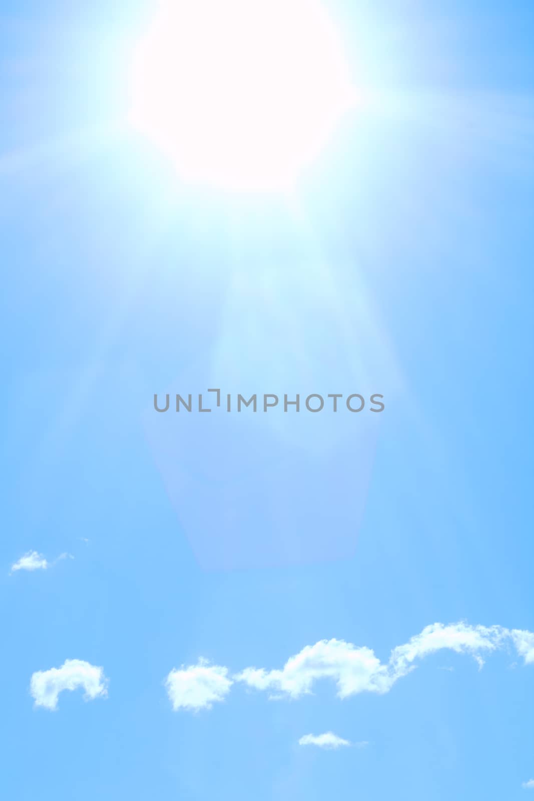Beautiful shining sun on blue cludy sky
