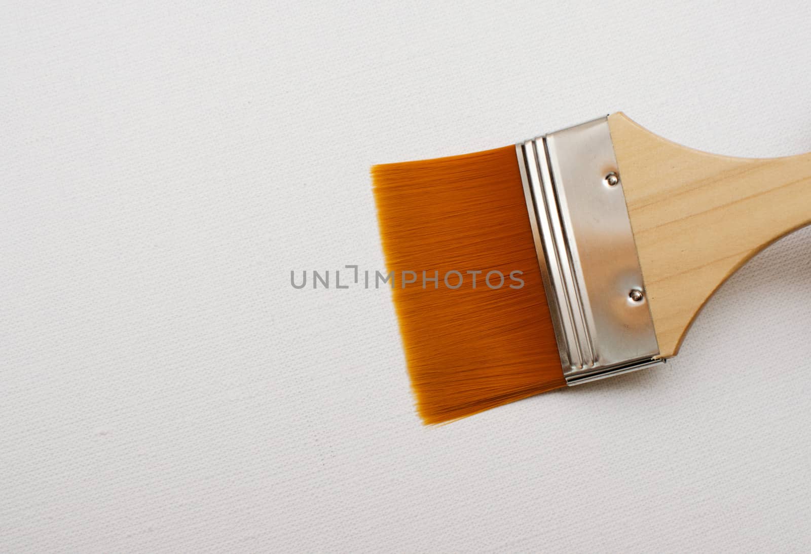 New paint brush isolated on white by DNKSTUDIO