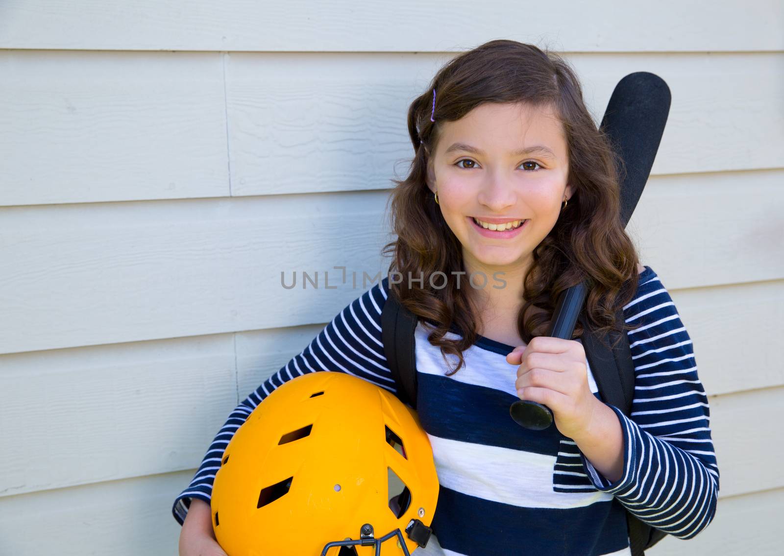 beautiful teen girl portrait with yellow helmet and baseball bat