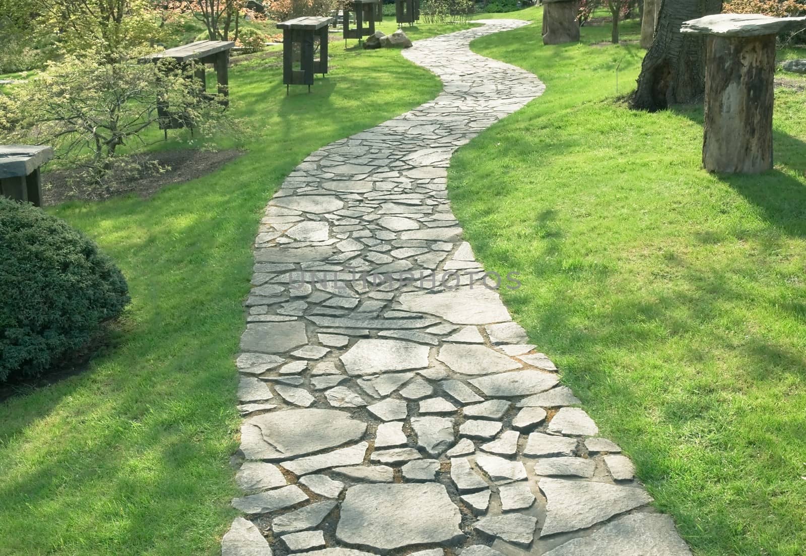 Path in the park paved with natural stone