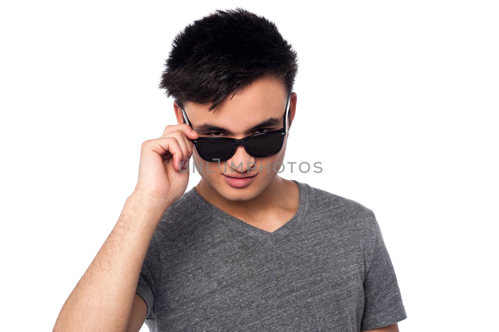 Handsome guy staring at you from within sunglasses