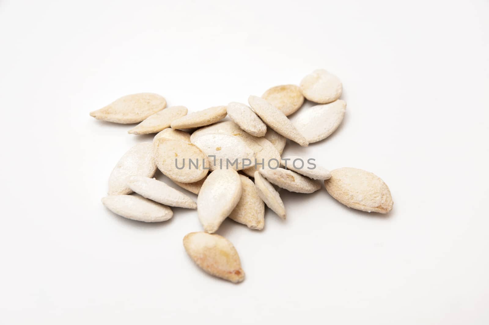 pumpkin seeds on a white background