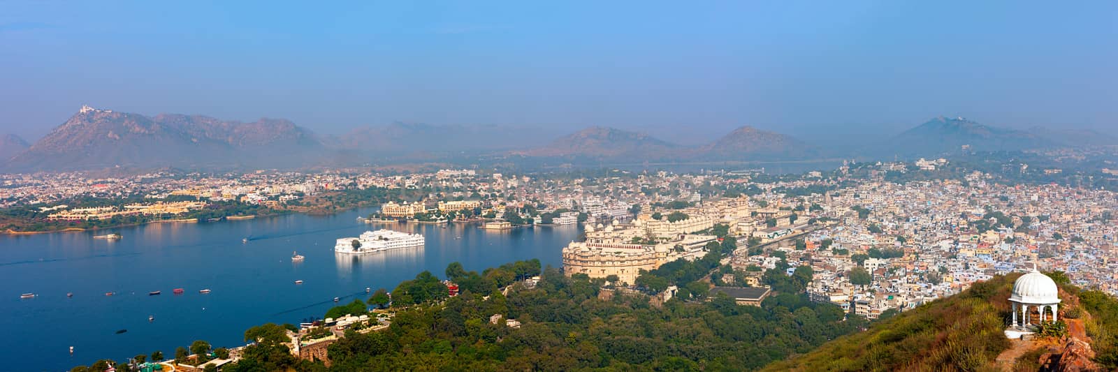 View of Udaipur from Machla Magra (Fish Hill). Lake Pichola, Udaipur hills, City Palace and the numerous attractions of the city. Udaipur, Rajasthan, India, Asia. Panorama.