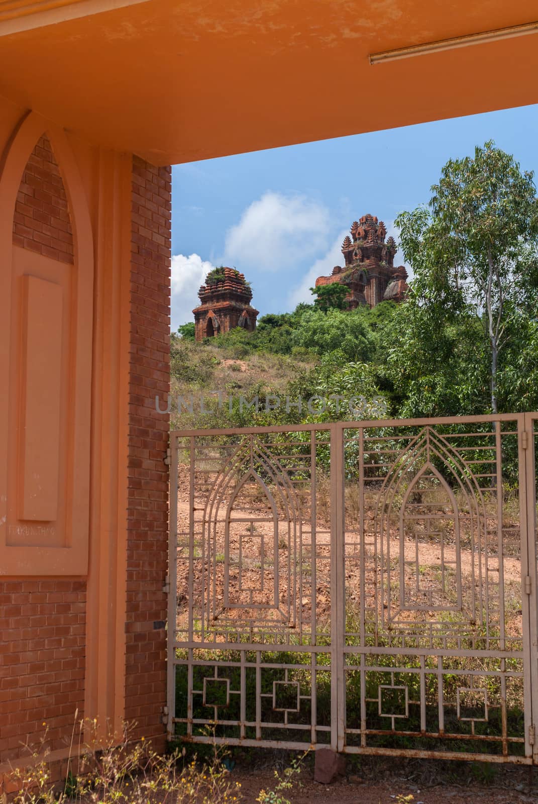The Banh It Cham towers seen through the entrance gate. by Claudine