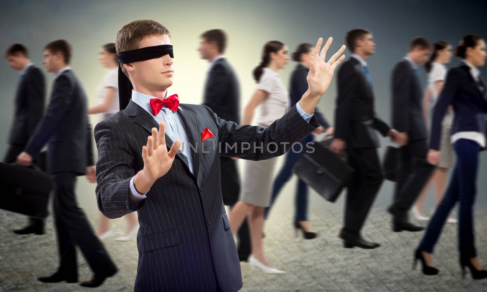 young blindfolded man. his arms and looking for a way out