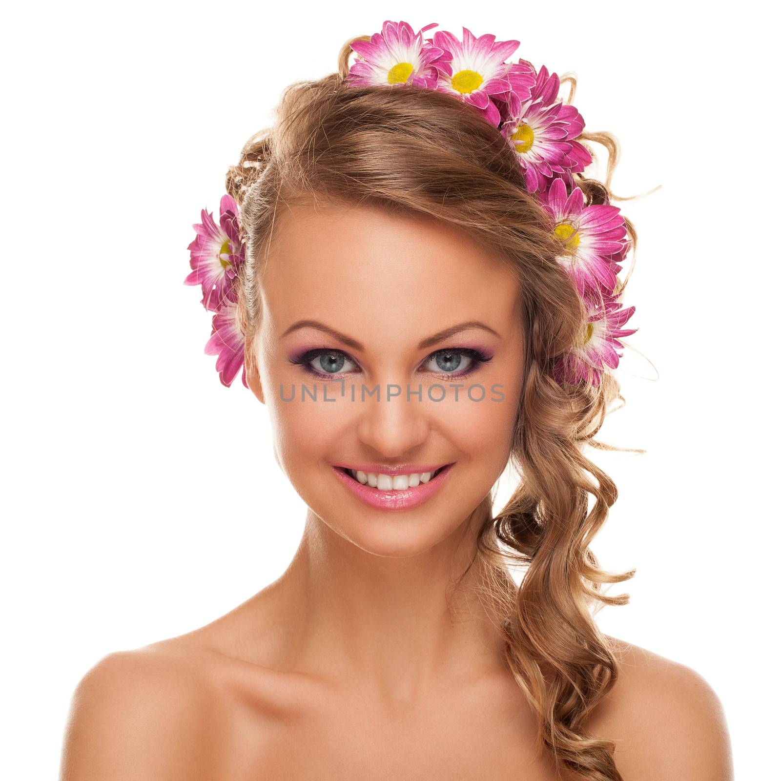 Beautiful young caucasian woman with flowers in her hair isolated over white background