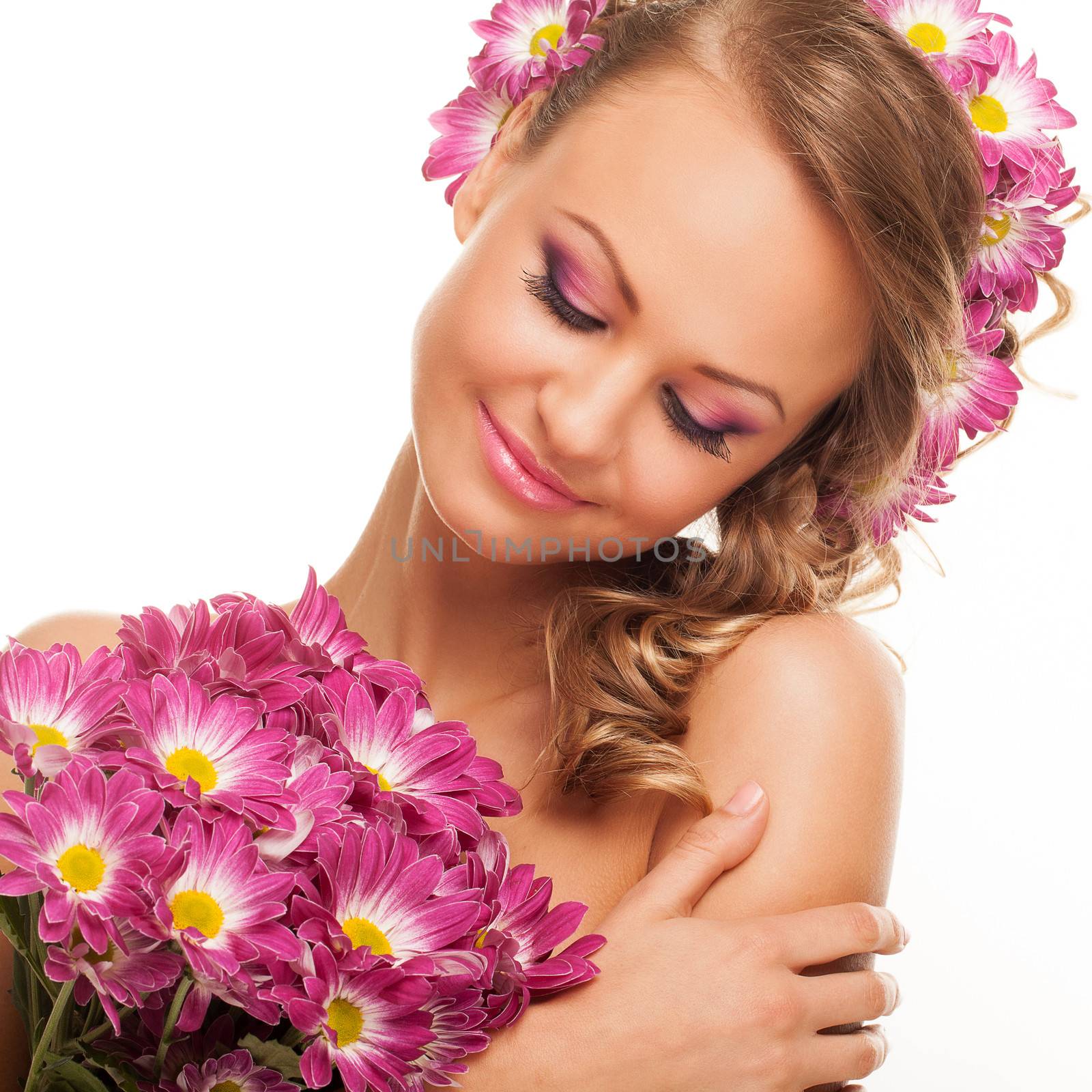 Closeup image of beautiful young caucasian woman with flowers over white background