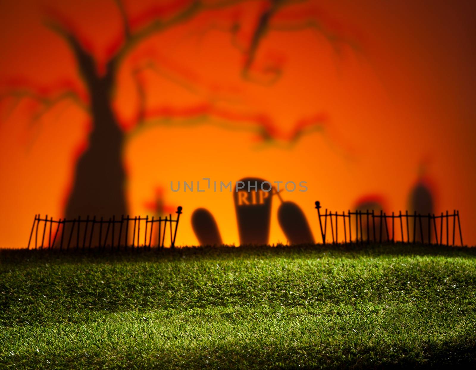 Halloween colorful landscape with tree and graveyard