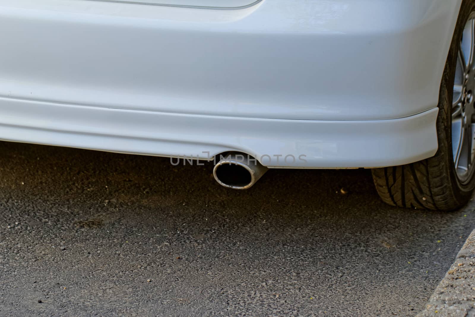 exhaust of white car