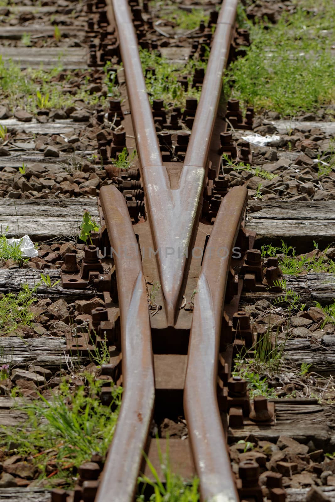 rusty railway track crossing