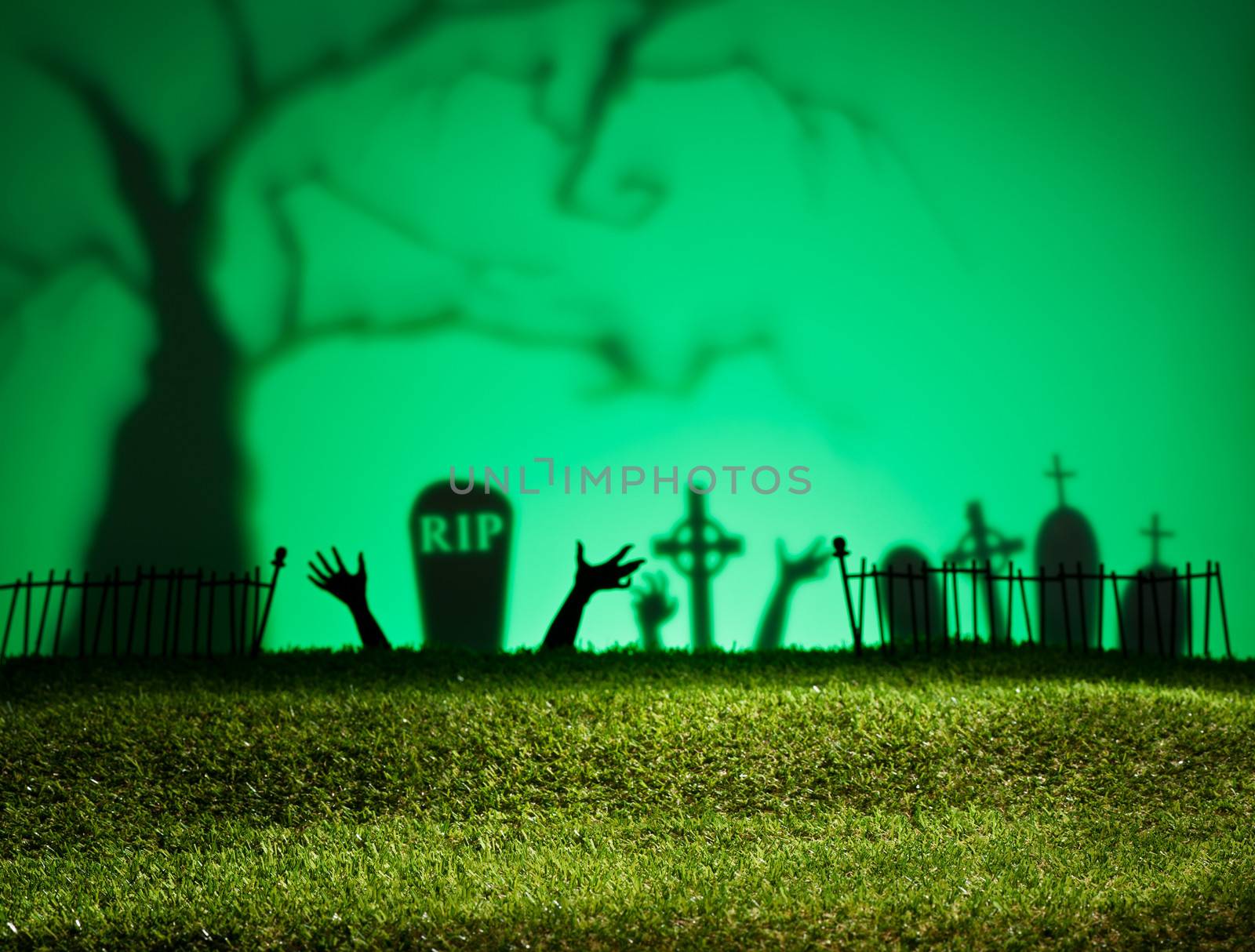 Halloween landscape with tree graveyard and green grass