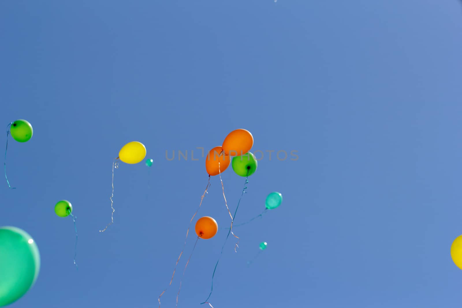 color balloons flying to the sky