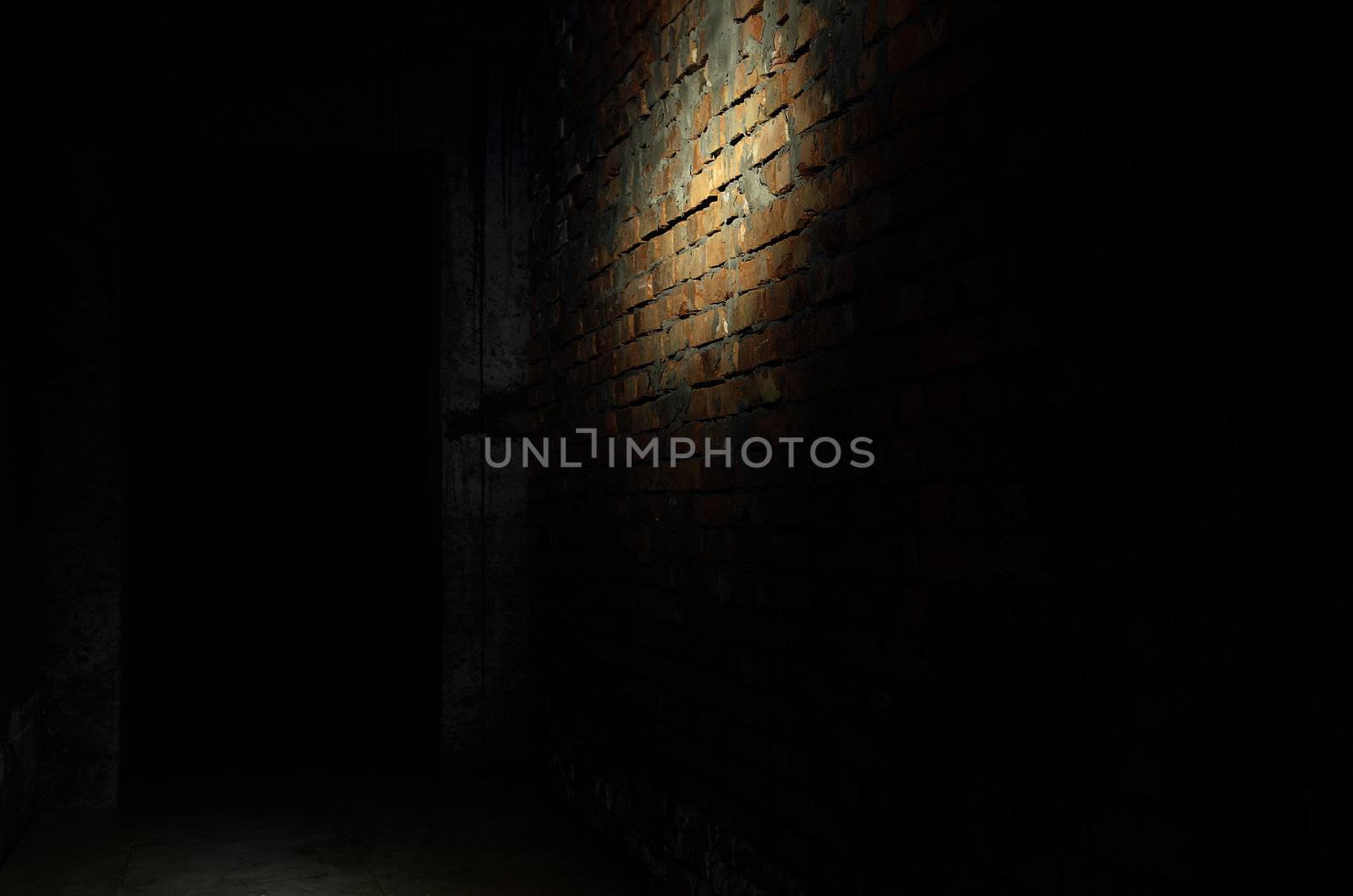 Photo of the bricky wall in the darkness