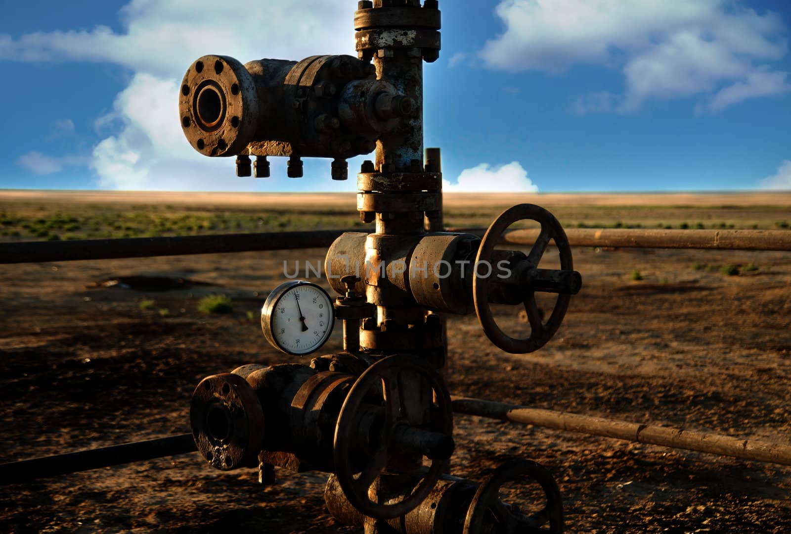 Photo of the old rusty oil rigs with preasure valve