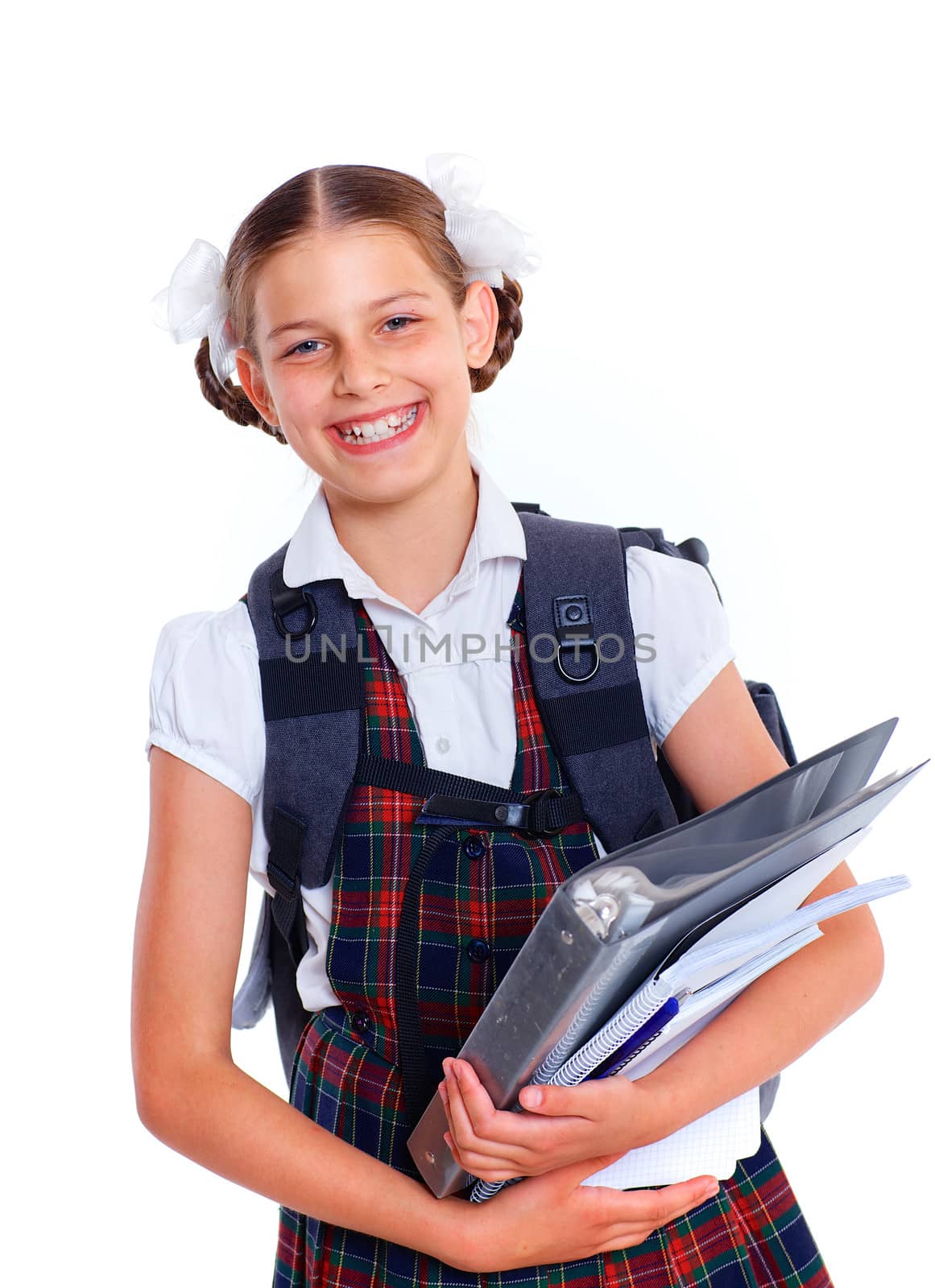 Education theme. Joyful schoolgirl smiling happily holding book