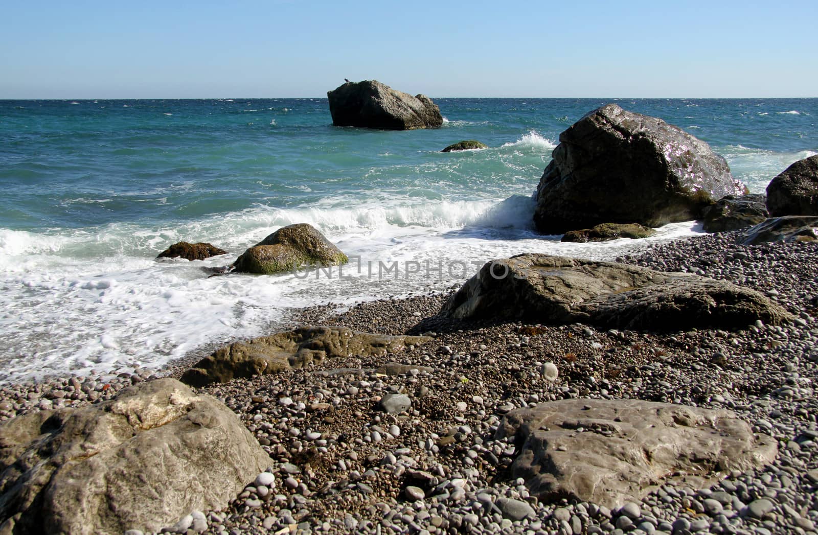 Marine rocky shore of Black sea with pebbles