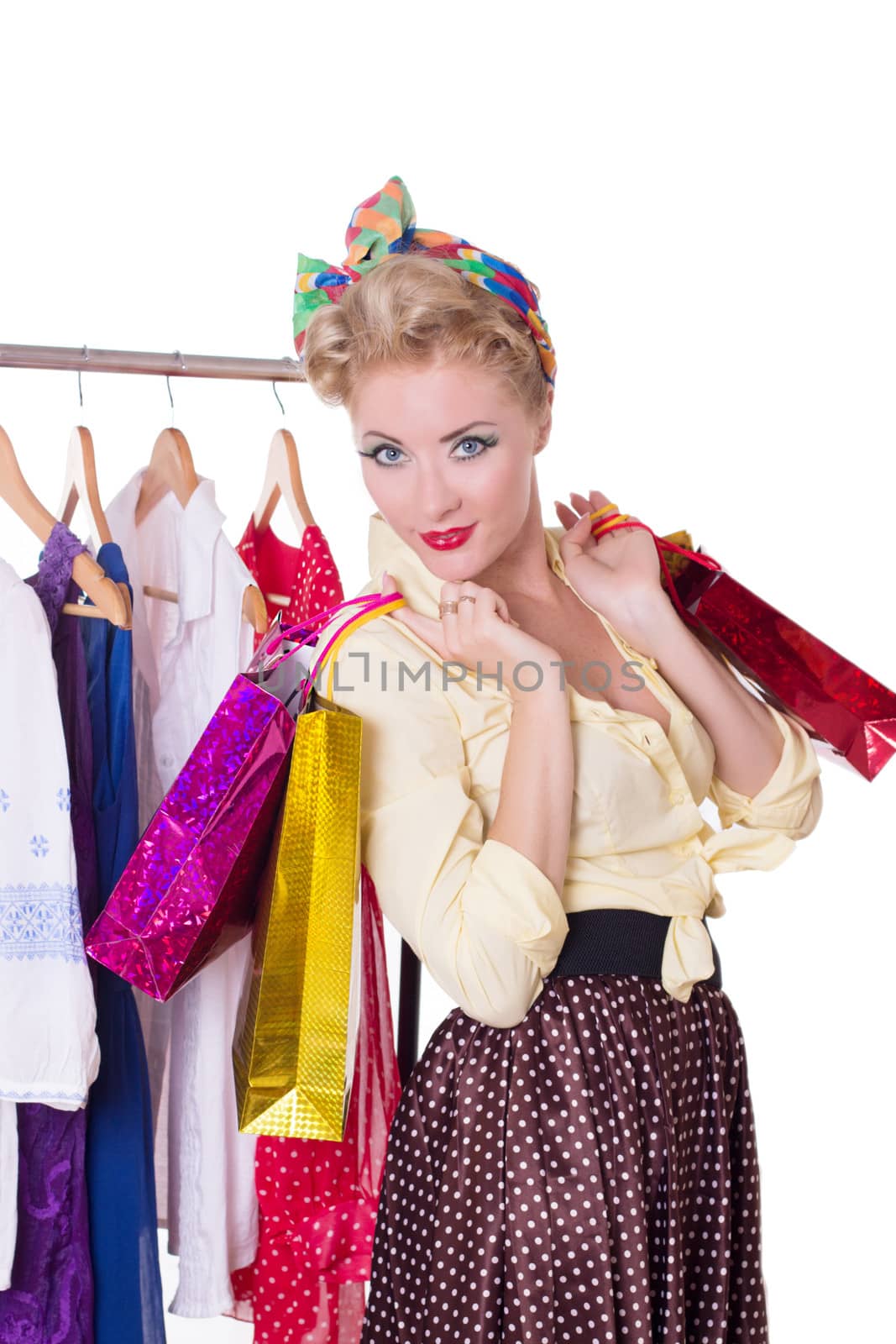 Pinup woman with shopping bags and hanger isolated on white