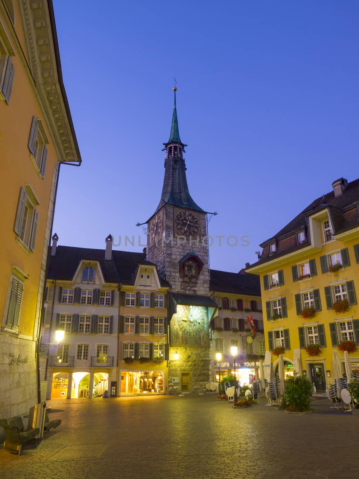 SOLOTHURN, SWITZERLAND - SEPTEMBER 21: Dawn at the Solothurn Clock Tower on September 21, 2010 in Solothurn, Switzerland. This clock tower was the town's oldest construction since the 13th century.