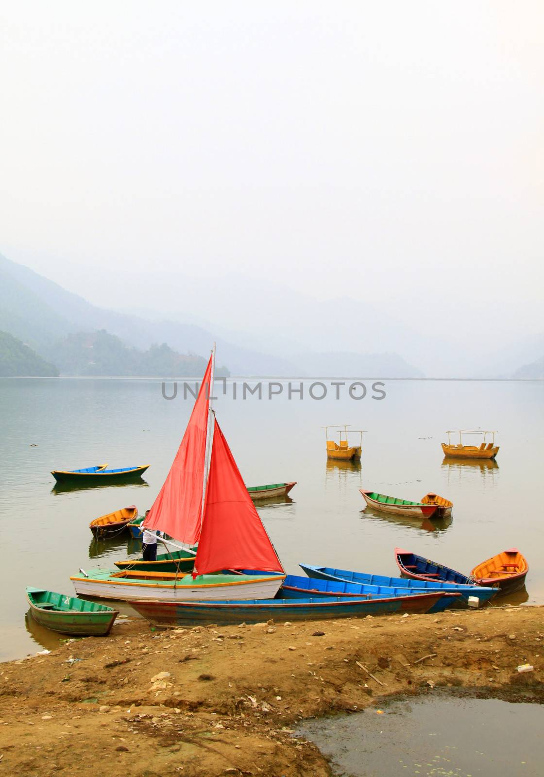 Boats on Phewa lake in Pokhara, Nepal  by nuchylee