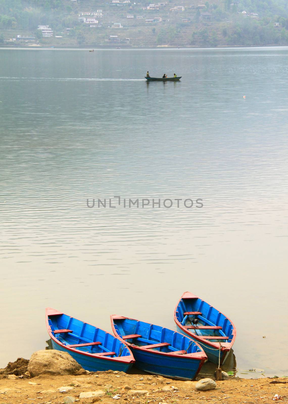 Boats on Phewa lake in Pokhara, Nepal 