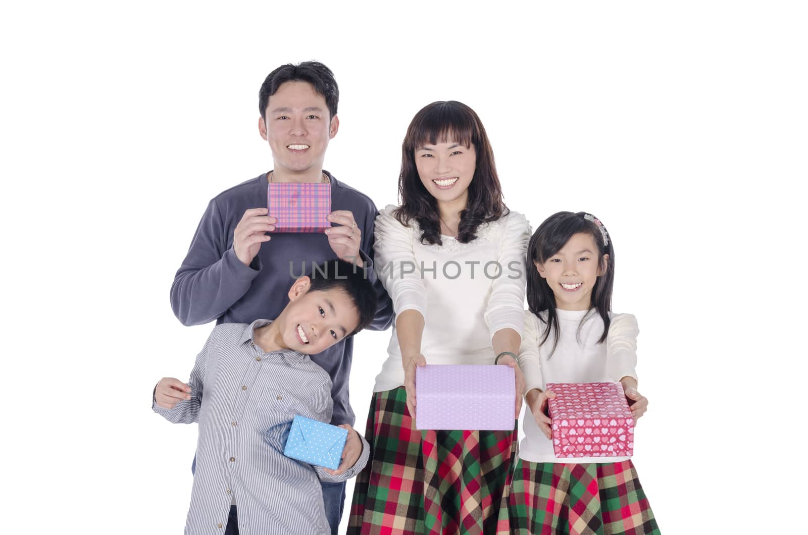 family smiling holding gift